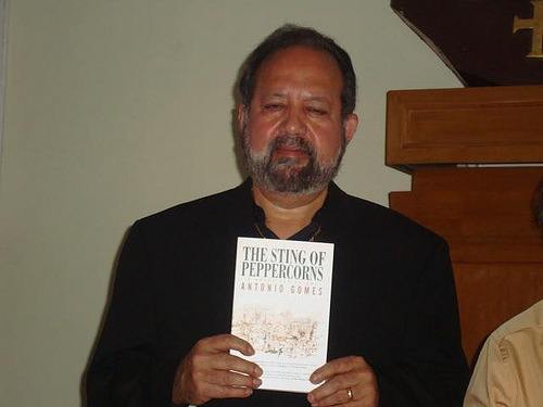 The author poses with a just-off-the-presses copy of his work.
